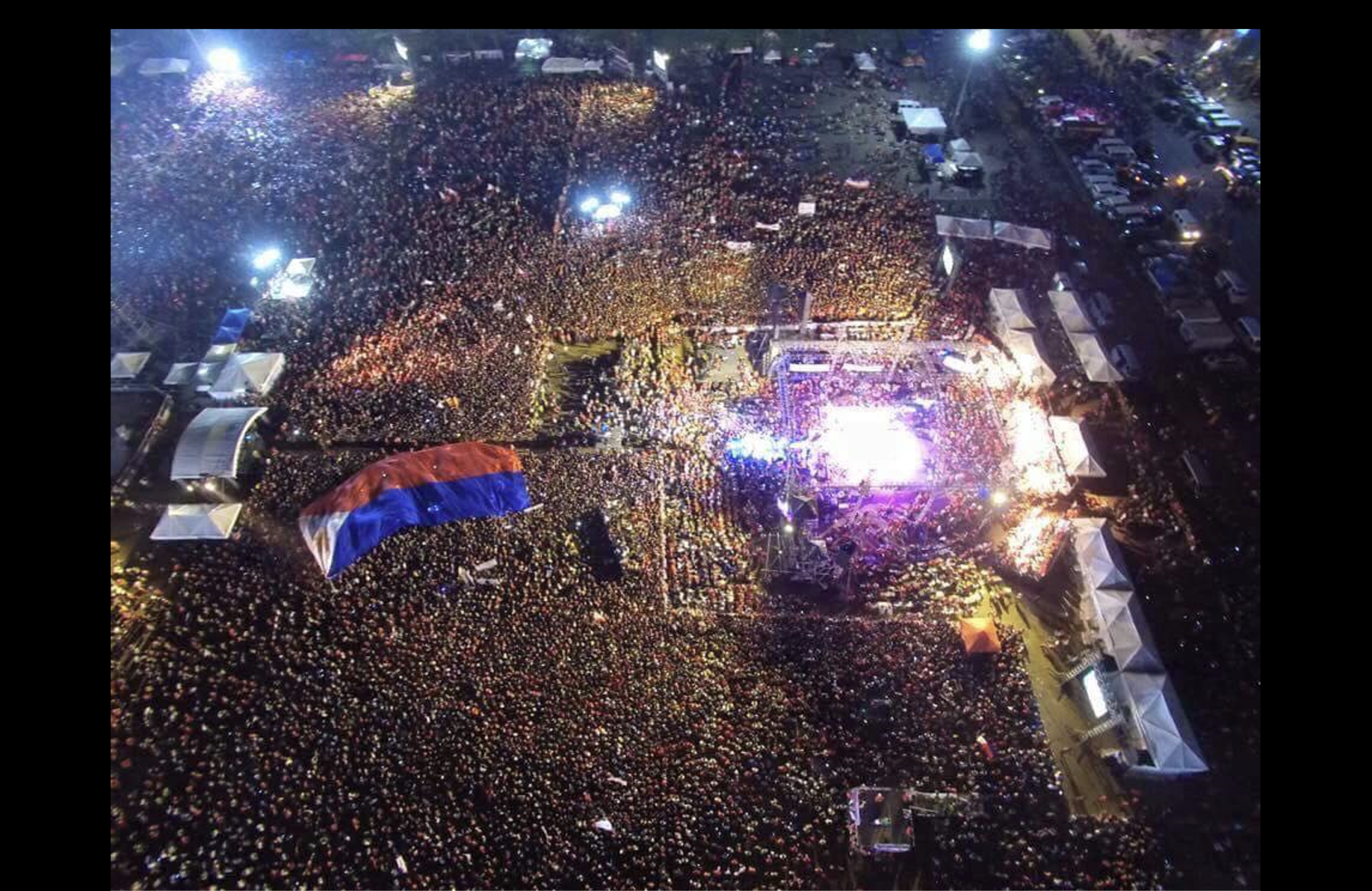 Aerial view of the massive Miting de Avance crowd for the 2016 Duterte-Cayetano campaign at Luneta Park in May 2016, demonstrating the scale of the organic support.